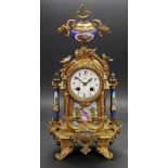An ornate French gilt metal and porcelain mounted mantel clock, circa 1890,
