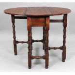A late 17th century oak gateleg table, of good colour, with hinged oval top above an end drawer,