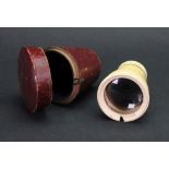 A turned ivory cased gilt metal monocular, early 19th century, with single draw,