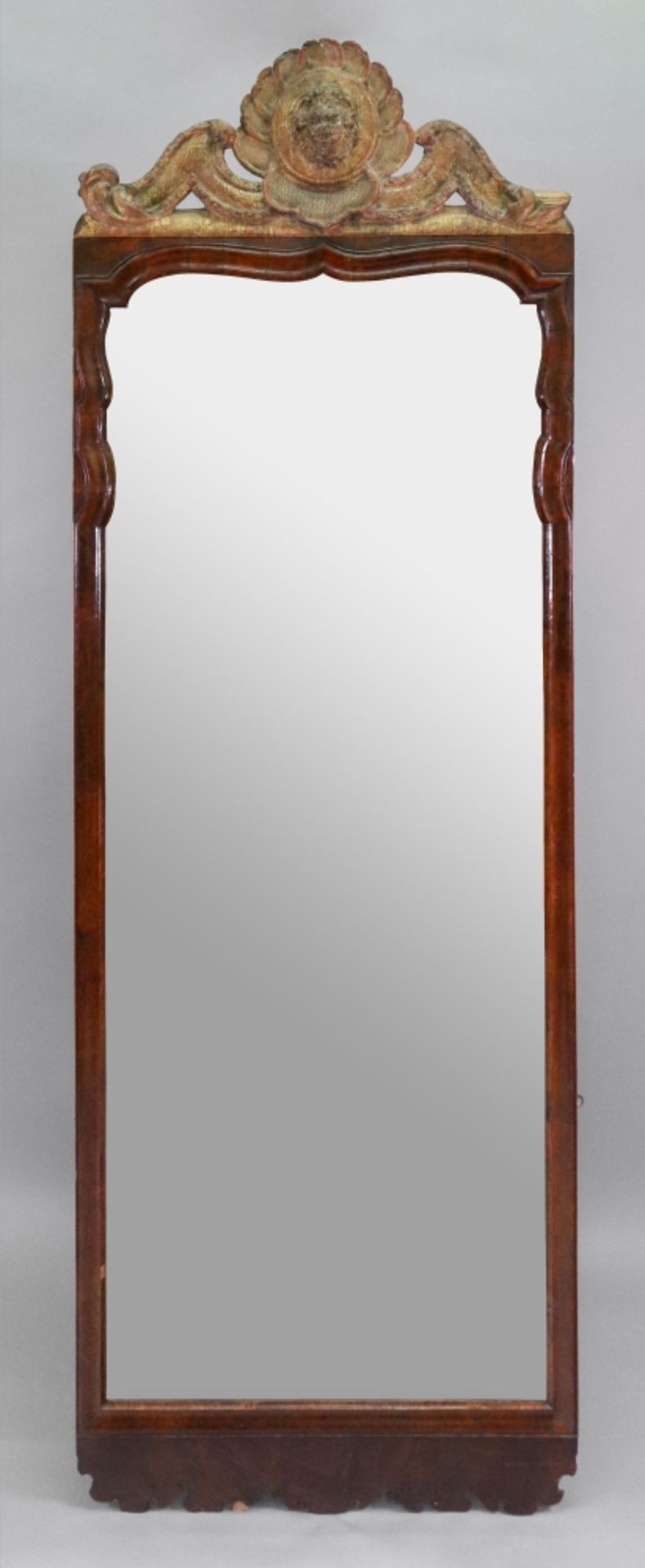 A tall early 18th century walnut frame upright wall mirror,
