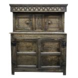 A Jacobean carved oak court cupboard, of panelled construction,