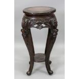 A Chinese stained as mahogany vase stand, late 19th/early 20th century,