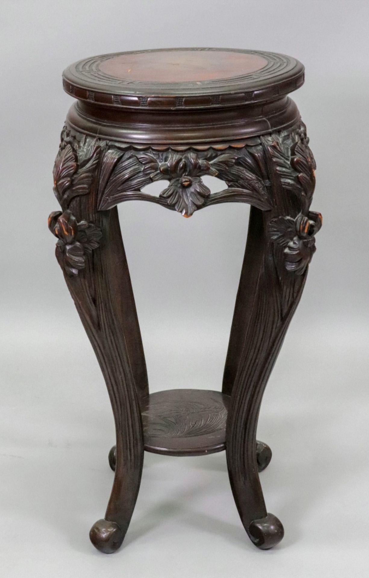 A Chinese stained as mahogany vase stand, late 19th/early 20th century,