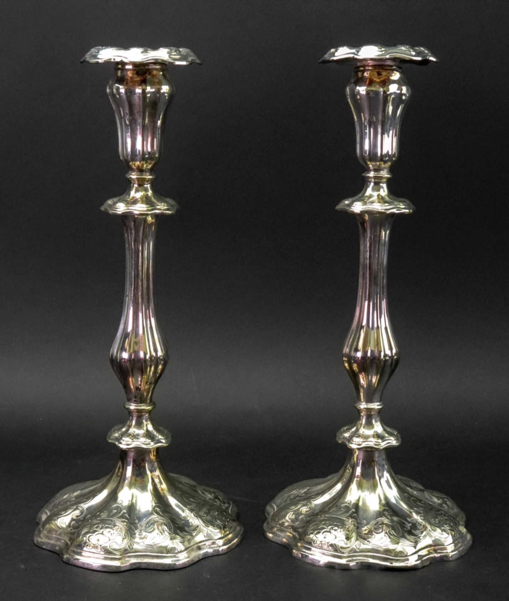 A pair of Victorian electroplate candlesticks,