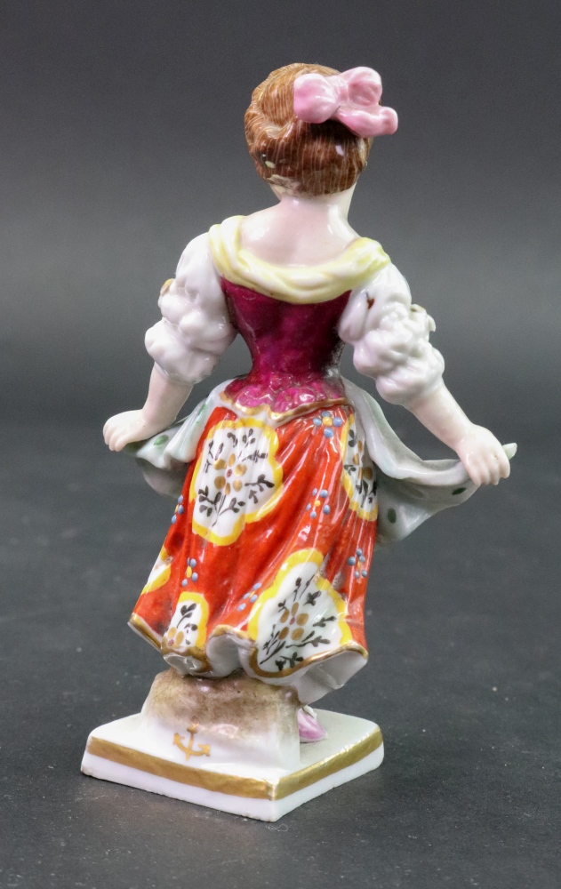 A Sampson porcelain figure of a young girl, her hands gathering up her dress, 11cm high. - Image 2 of 2