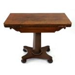 A William IV mahogany card table, the hinged fold over top above a scroll carved frieze,