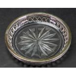 A George III silver gilt mounted shallow circular glass dish, London 1802, with foliate border,