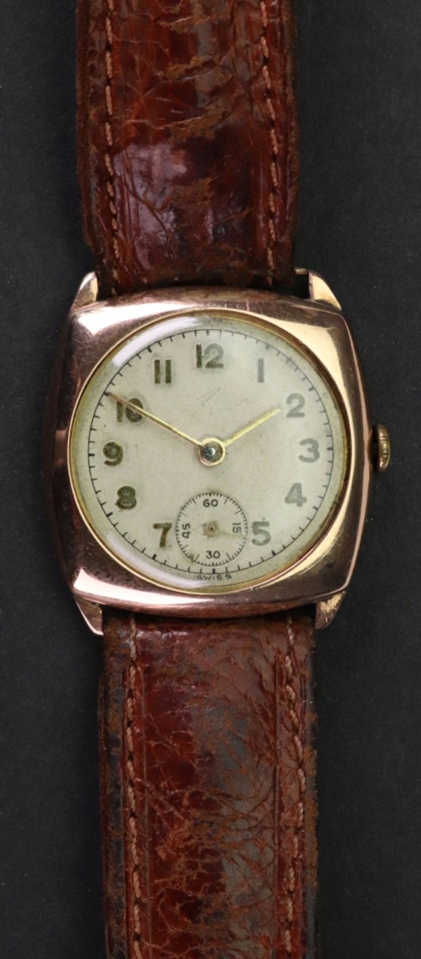 A 9ct rose gold cased wristwatch, the white enamelled dial with applied gilt metal Arabic numerals,