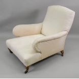 A Victorian deep seated armchair, circa 1880, on turned legs with Copes Patent gilt brass castors,
