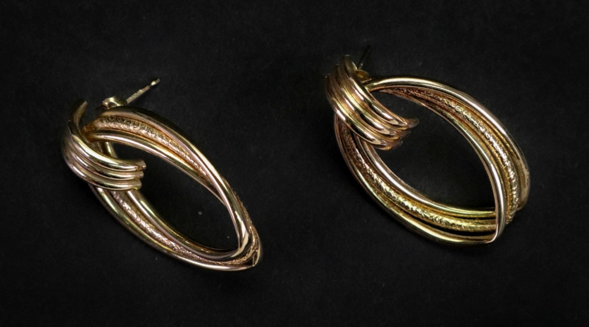 A pair of 9ct gold earrings, of openwork flattened hoop design, detailed '375' to backs, 3.
