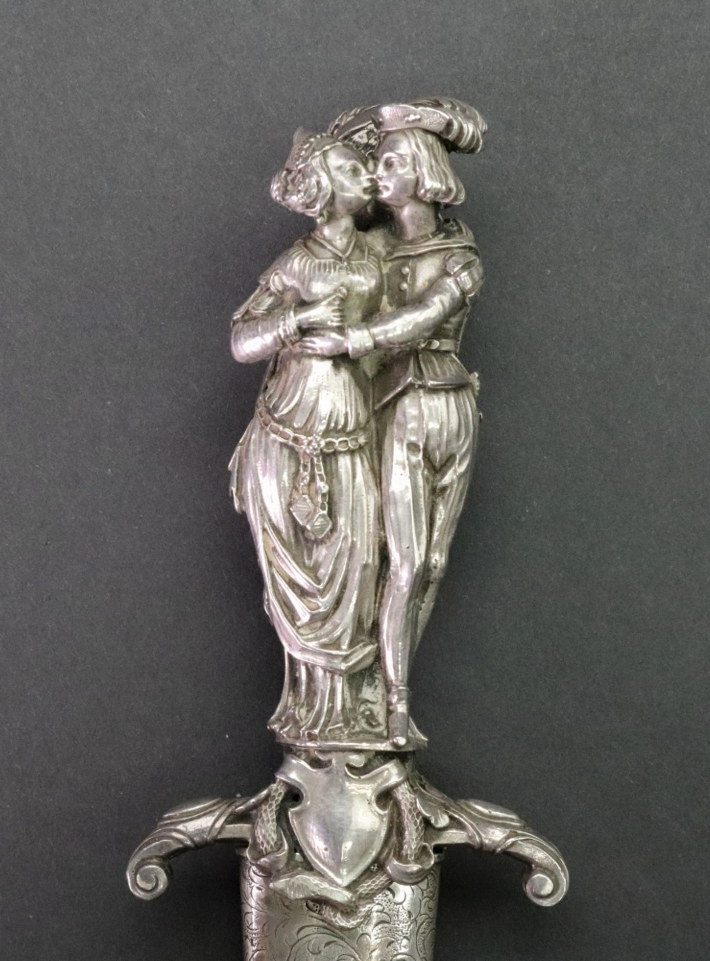 A silver handled dagger, cast as three standing figures dressed in period costume, - Image 3 of 7