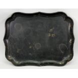 A Victorian black papier mache tray, of shaped rectangular outline, painted with flowers,