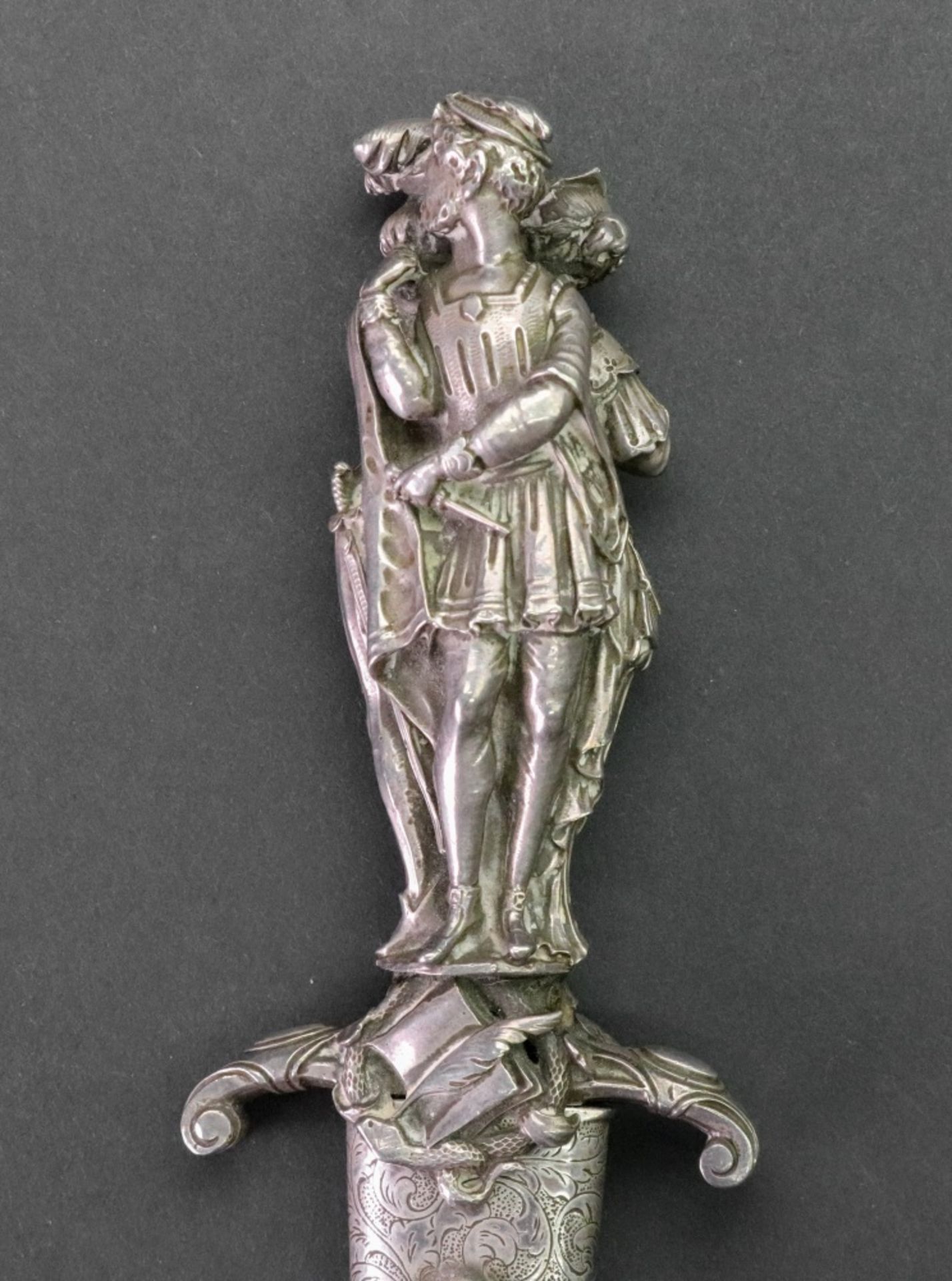 A silver handled dagger, cast as three standing figures dressed in period costume, - Image 4 of 7