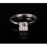 A platinum and diamond single stone ring, the Princess-cut diamond approximately 0.