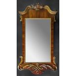 A mid 18th century and later upright wall mirror,