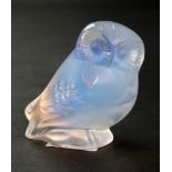 A Lalique opalescent glass figure of an owl, etched 'Lalique France', 5.5cm high.