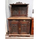 A late 17th century oak dwarf cupboard, altered, of panelled construction,