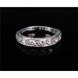 An 18ct white gold and diamond-set half-hoop ring,