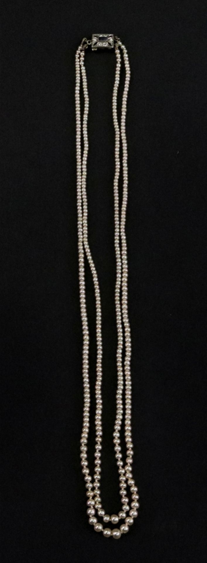 A double string of seed pearls of graduated design, (presumed natural, un-tested),