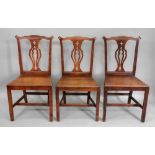 A set of six George III country Chippendale style oak and elm dining chairs,