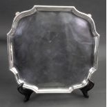 A George I style square silver salver, Daniel and John Wellby, London 1920,