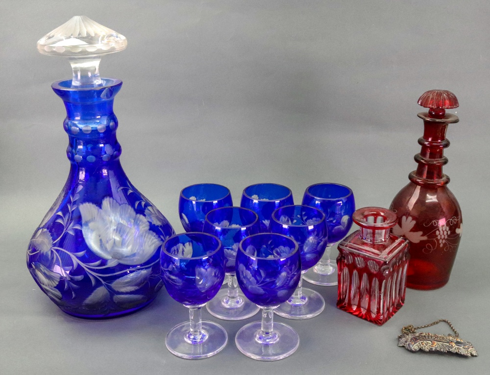 A glass decanter and stopper and seven g