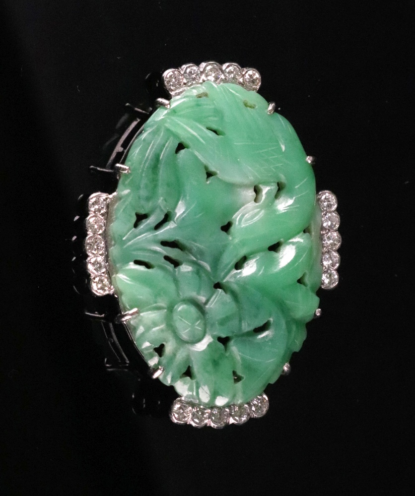 A pierced and carved jadeite and diamond