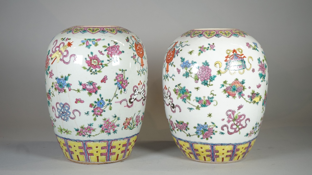 A pair of early 20th century Chinese vases, (lacking covers), decorated with Buddhist symbols, - Image 3 of 4