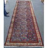 A Hamadan runner, Persian, 330cm x 113cm.