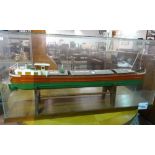 A large 20th century scratch built model of a French barge, Jocelyne, in a glass case,