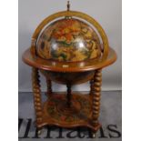 A 20th century drinks cabinet, formed as a globe, 75cm wide x 110cm high.