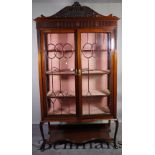 An early 20th century mahogany display cabinet, with pair of glazed doors,