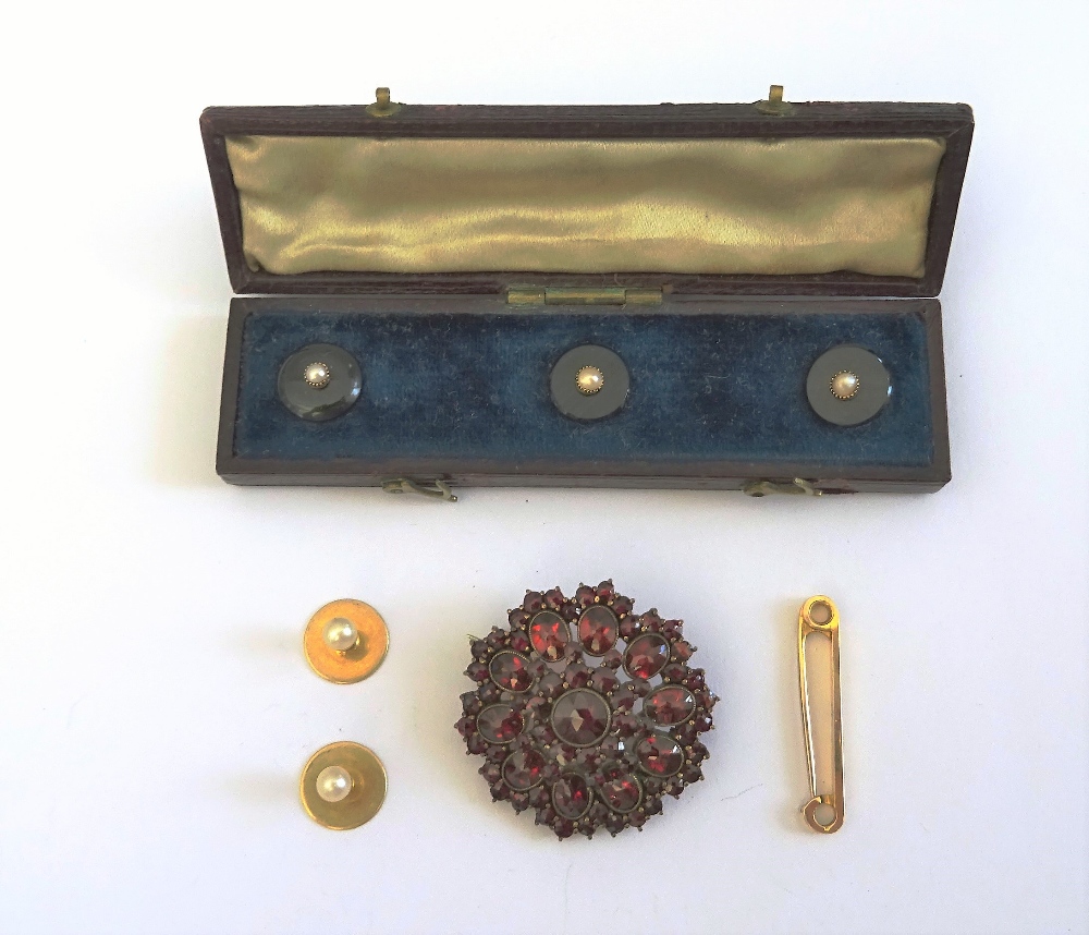 A set of three Victorian gold, black onyx and half pearl set dress studs, with a fitted case,