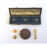 A set of three Victorian gold, black onyx and half pearl set dress studs, with a fitted case,