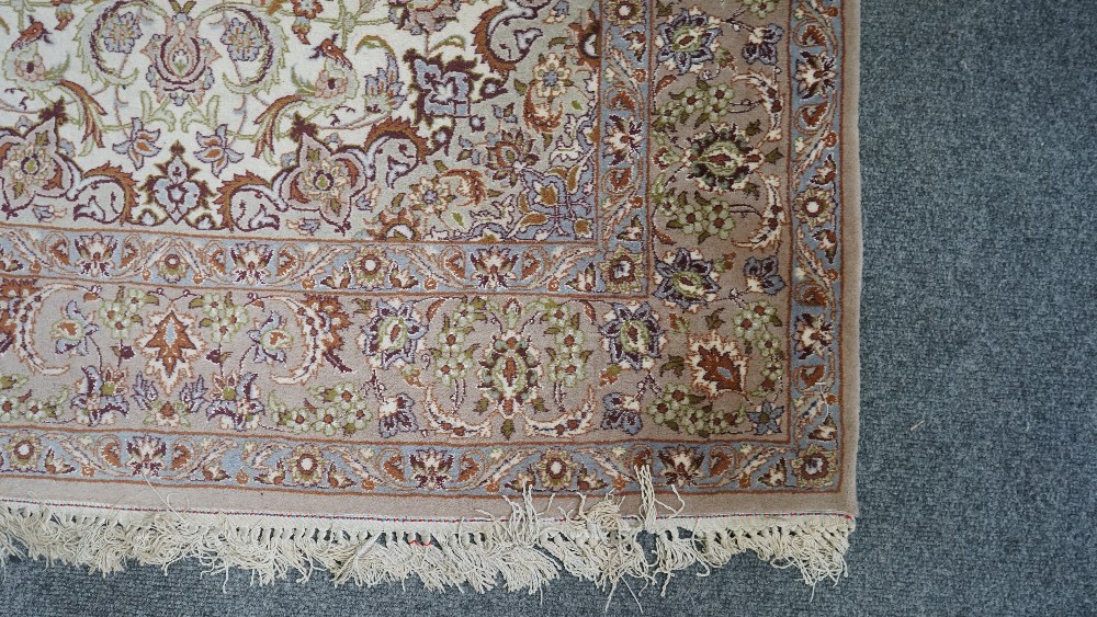 A fine part silk Esfahan rug, Persian, the ivory field with a brown shaped medallion, - Image 4 of 5