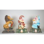 A group of three 20th century painted cast iron door stops, Punch & Judy and a lion, each 35cm high,