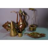 A group of copper and brass including a Turkish ewer, lidded pots,