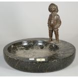 A 20th century bronze figure of a child, mounted on a dished granite base, 23cm high x 30cm wide.