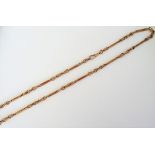 A 9ct gold chain, in a twin bar and knot link design, with a swivel clasp, weight 46.6 gms.