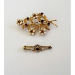 A 9ct gold, garnet and cultured pearl brooch, designed as a floral and foliate spray and a 9ct gold,
