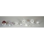 Swarovski; a group of eight figures comprising, an owl, a yacht, a poddle, a cobra, an ammonite,