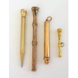 A gold cased propelling pencil, presentation inscribed, detailed 9 CT,