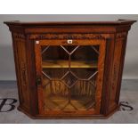 A 20th century carved oak display cabinet with astragal glazed doors, 97cm wide x 74cm high.