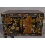 An early 20th century chinoiserie decorated table top cupboard, 48cm wide x 29cm high.