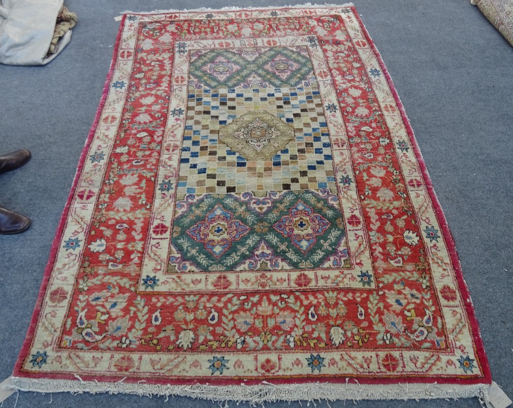 A Mahal rug, the chequered feel with a medallion to the centre,