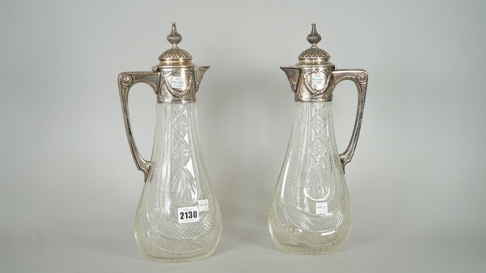 A copy of a pair of Faberge faceted glass claret jugs, each body of swept oval form, - Image 2 of 6