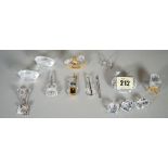 Swarovski, a group of twelve figures, including; musical instruments and toys, (12).