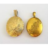 A Victorian gold back and front, shaped oval twin sided pendant locket,