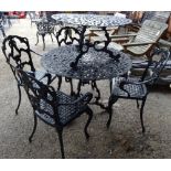 A set of four 20th century black metal garden chairs to include two carvers,