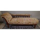 A Victorian walnut framed upholstered chaise longue, on turned supports, 190cm long x 77cm high.